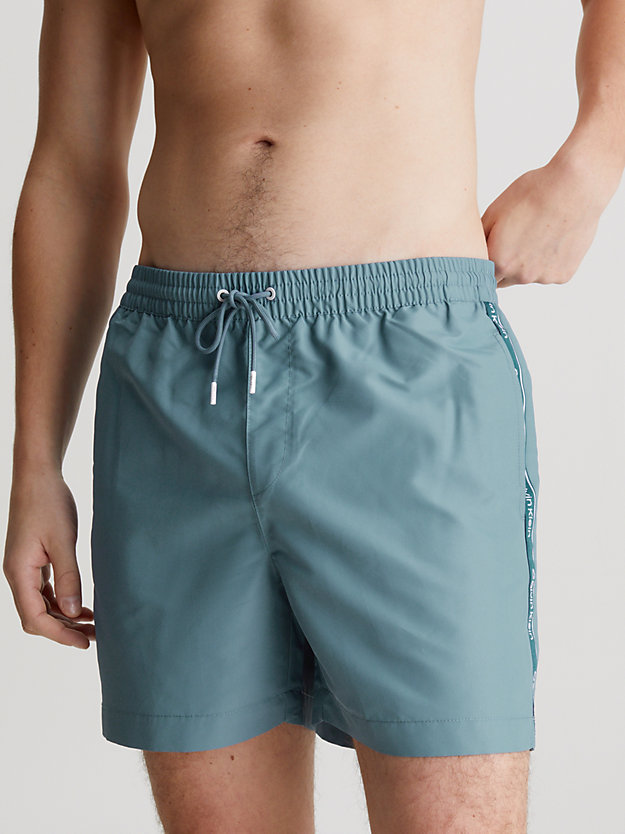 muted cerulean medium drawstring swim shorts - logo tape for men calvin klein