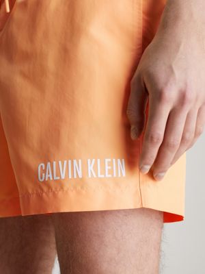 Calvin klein best sale orange swim shorts