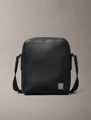 black emblem logo textured reporter bag for men calvin klein
