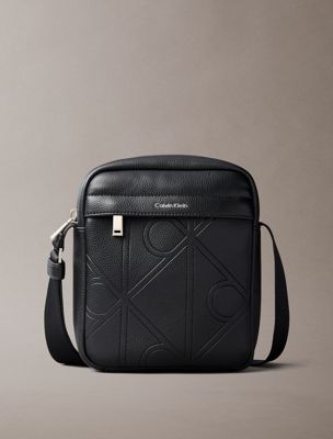 black embossed emblem logo reporter bag for men calvin klein