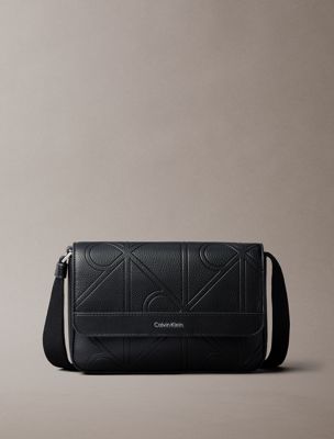 black embossed emblem logo messenger bag for men calvin klein