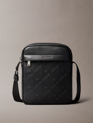 black embossed emblem logo reporter bag for men calvin klein