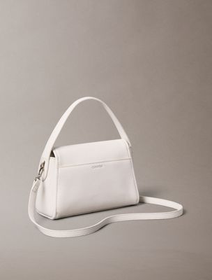 white pebble grain shoulder bag for women calvin klein