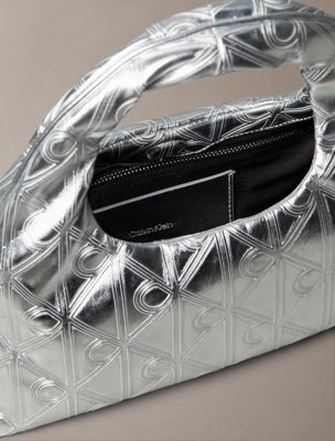 silver metallic puffer emblem logo metallic mini bag for women calvin klein