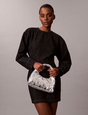 silver metallic puffer emblem logo metallic mini bag for women calvin klein