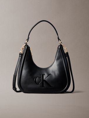 black halbmond-schultertasche mit klassischem logo für damen - calvin klein