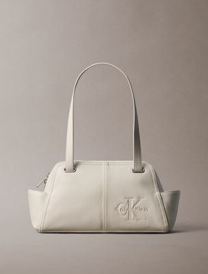 beige embossed monologo shoulder bag for women calvin klein