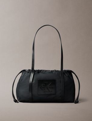 black embossed monologo satchel bag for women calvin klein