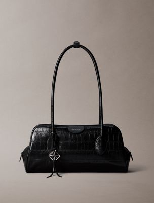 black emblem logo crocodile shoulder bag for women calvin klein