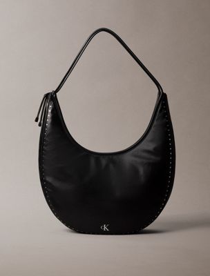 black large studded crescent hobo bag for women calvin klein