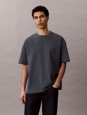 blue oversized embossed logo t-shirt for men calvin klein jeans