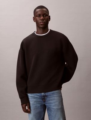 black relaxed embossed logo sweatshirt for men calvin klein