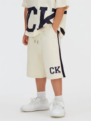 white relaxed varsity logo shorts for boys 