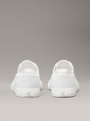 triple bright white canvas low profile trainers for men calvin klein jeans