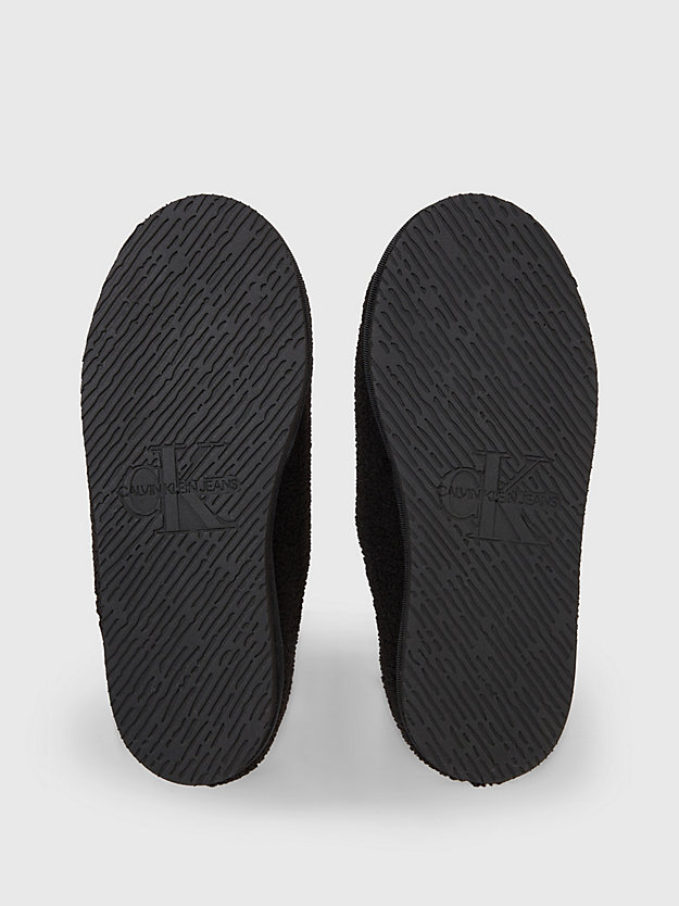 chaussons en peau de mouton retournée synthétique black/bright white pour femmes calvin klein jeans